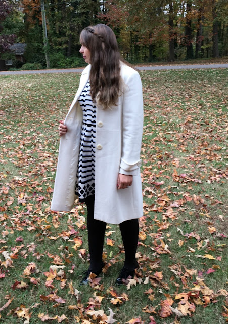 I am making a bold statement by pairing winter white and black together in a geometric print dress and wool coat. 