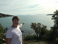 Pointing at the other side of the Cook Strait - the South Island