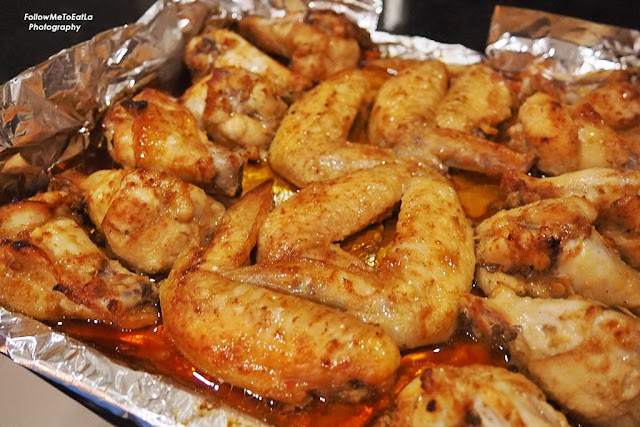 Bast the chicken wings with the leftover marinade when it has cooked for 15 minutes.