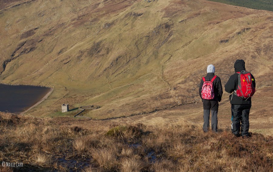 Hillwalkers observing Lough Altan Farm from high up in the Donegal Hills