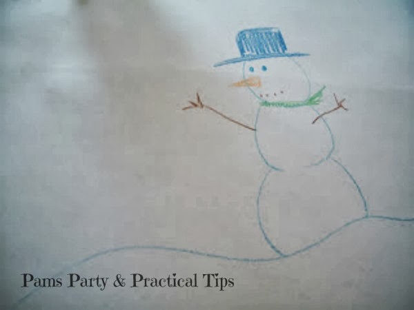 snowman drawings on a table cover for snowman party 