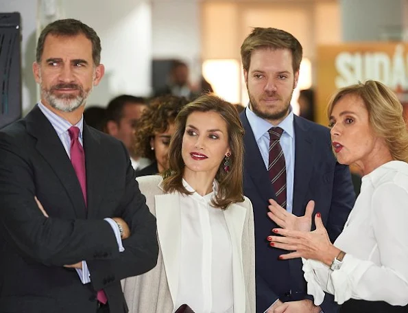 Queen Letizia wore Uterque Nappa Trousers, and Hugo Boss blouse, Magrit suede pumps, Tous earrings