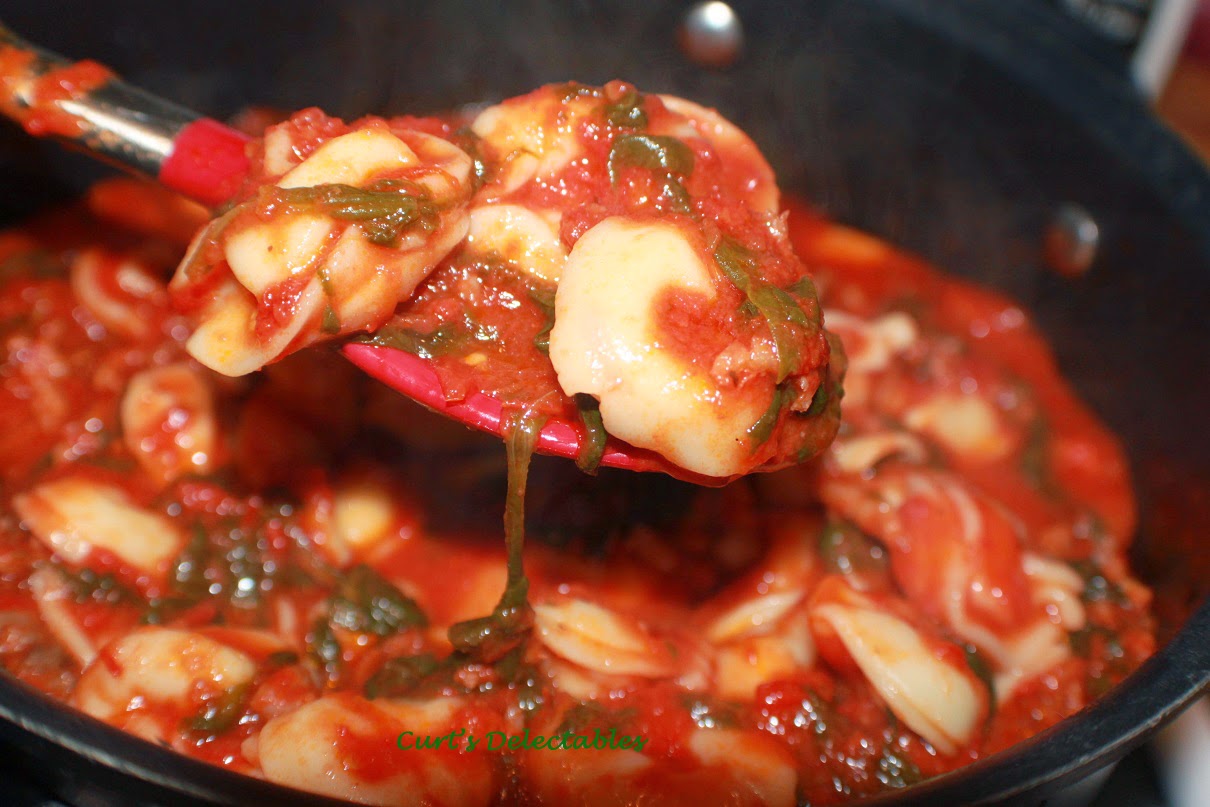 homemade tortellini with bolognese sauce baked wth spinach and cheese
