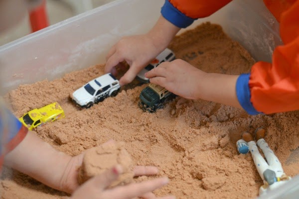 Homemade kinetic sand- don't waste your money on the store bought stuff when you can easily make this recipe at home! Squishy, mold-able, & lots of fun