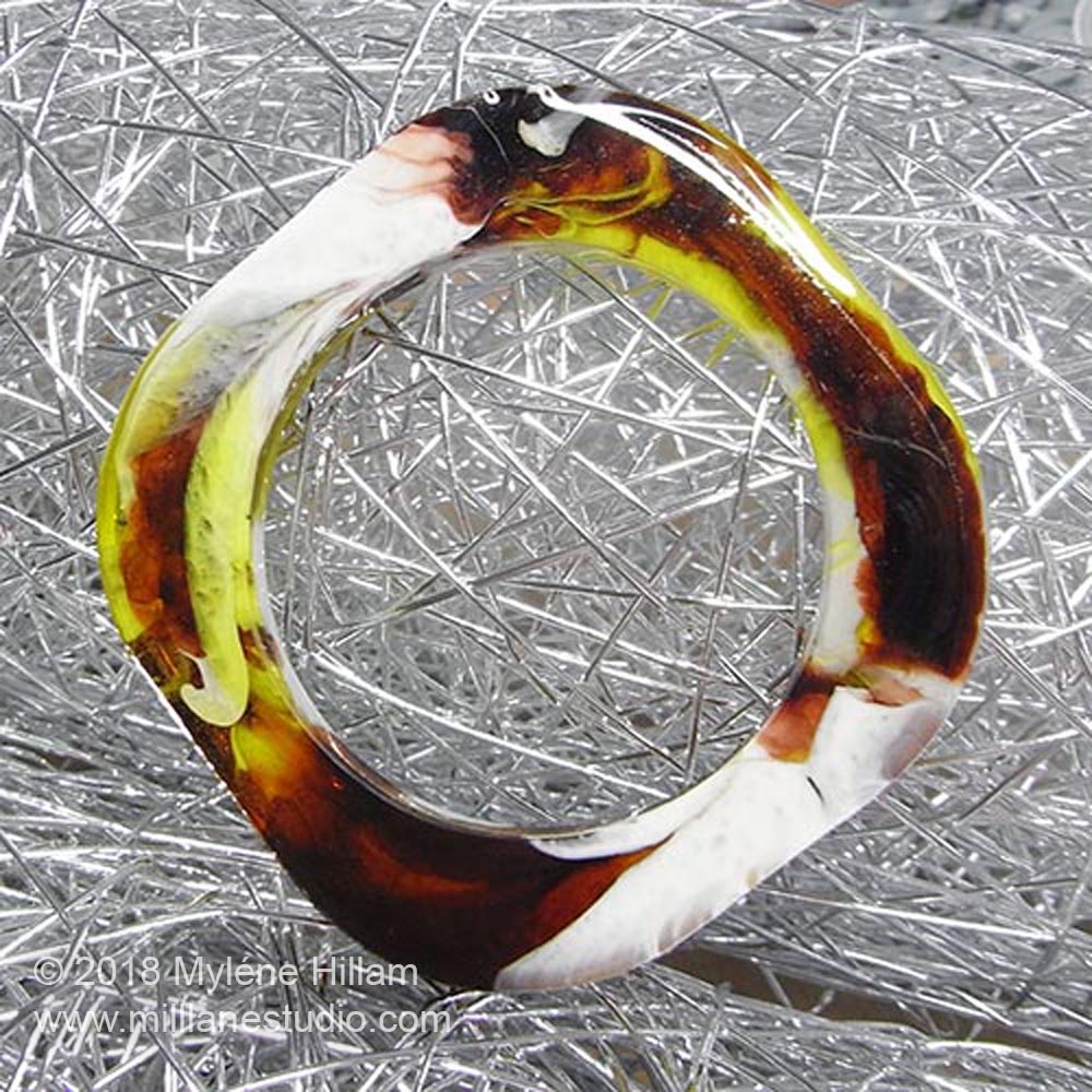 Resin bangle with marbled pigments and dyes cast from a square silicone mould.