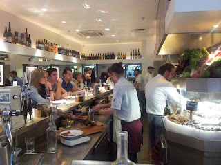 The L-shaped counter and open kitchen at Barrafina, Soho