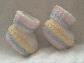 http://www.craftsy.com/pattern/knitting/accessory/spring-colours-baby-booties/202237?rceId=1460970809199~18crdian