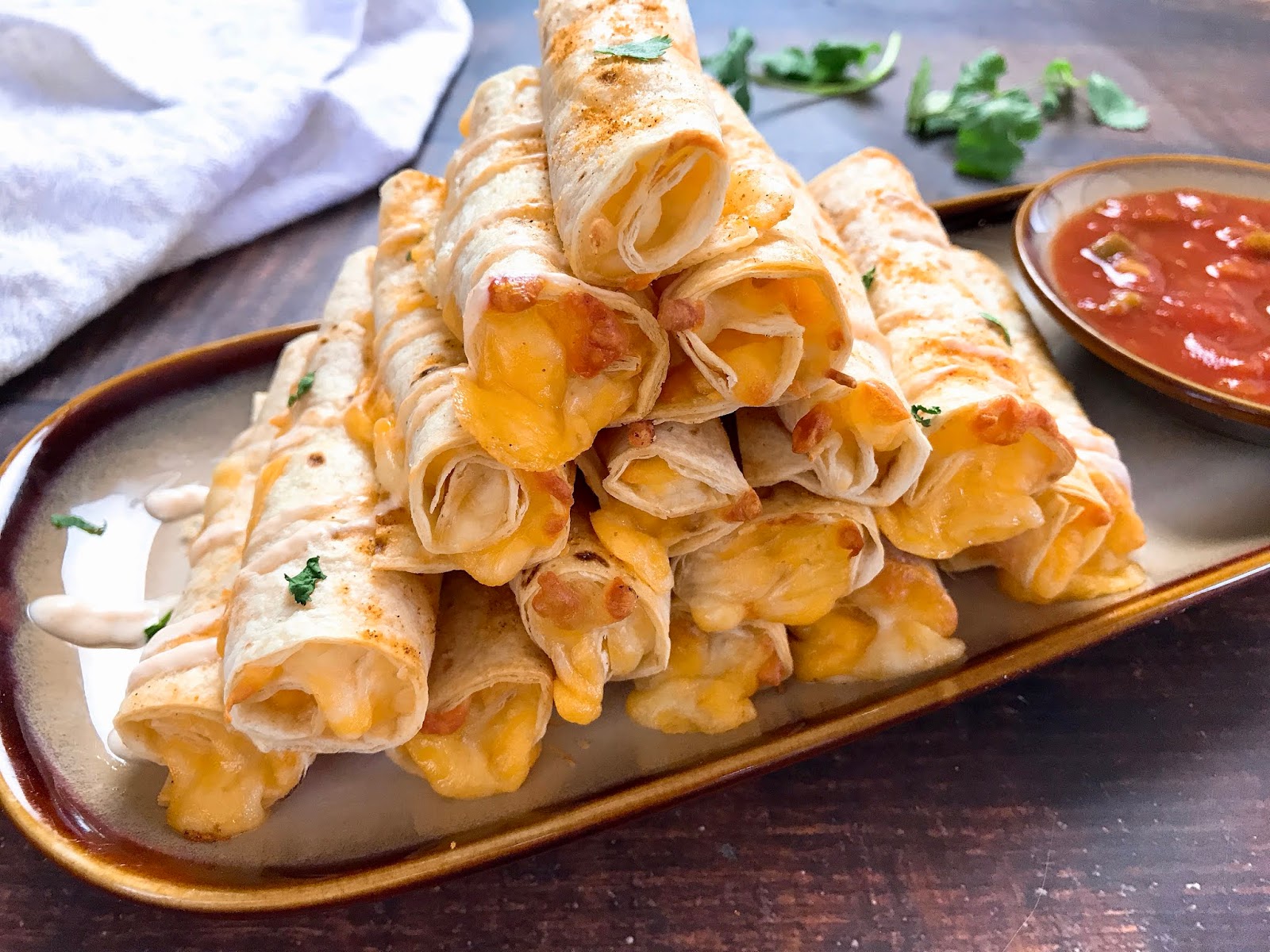 Baked Cheese Taquitos with Spicy Sour Cream