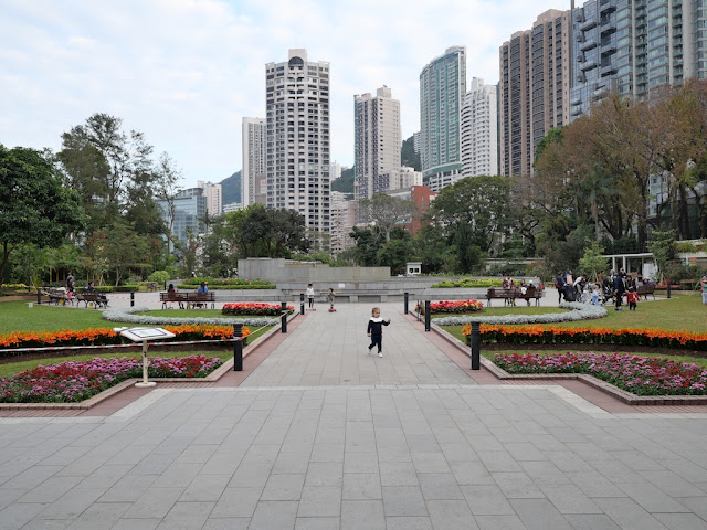 Little girl running at the Hong Kong Zoological and Botanical Garden