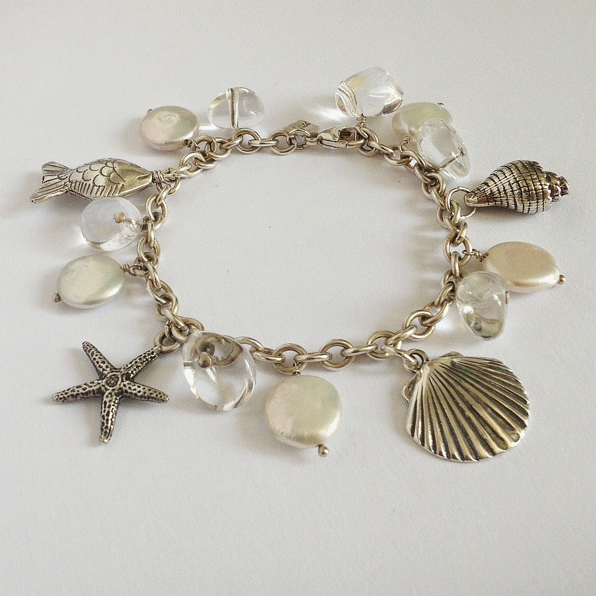 https://www.etsy.com/listing/191254500/beach-bracelet-clamshell-starfish-conch