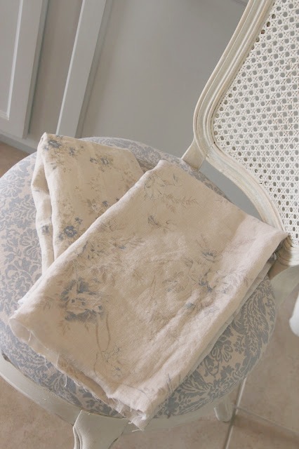 Shabby Chic Couture linen fabrics on vintage chair. Come read about Hello Lovely's Before and After DIY Serene Kitchen Makeover: Smart Upgrades, No Demo or Dust!