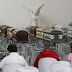 CASKETS CONTAINING THE REMAINS OF THE BRAZILIAN FOOTBALLERS LAID SIDE BY SIDE IN A FUNERAL HOME