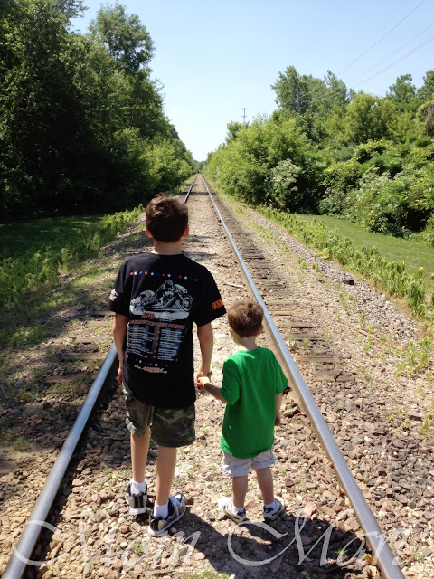 The boys playing on an abandoned railway