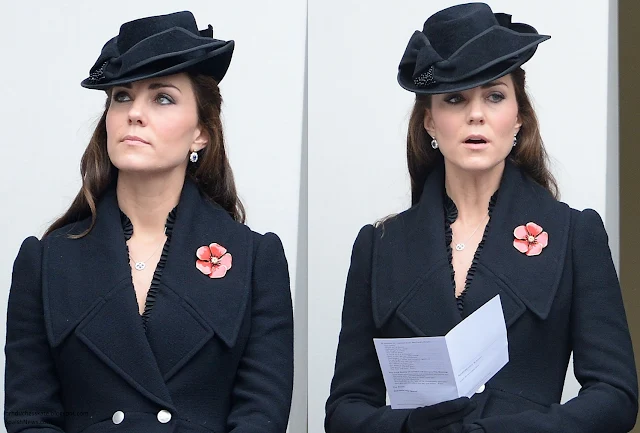 The Duchess wore Alexander McQueen Black flared wool coat.