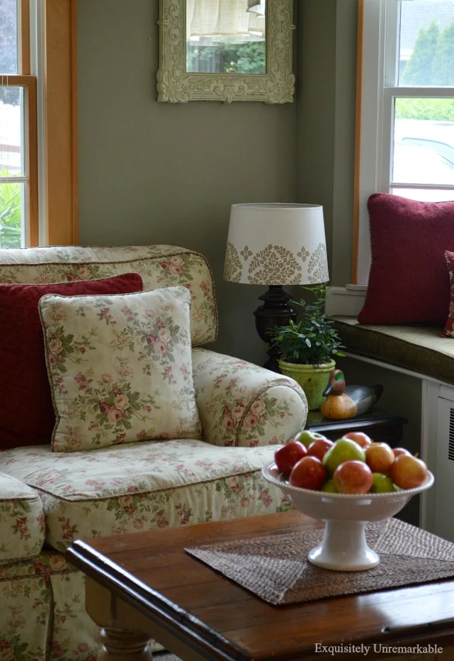 Cottage Style Den with floral couch and small coffee table