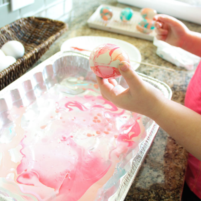How to marble Easter eggs with nail polish! #eastereggideas #eastereggs #marbling How to marble Easter eggs with nail polish! #eastereggideas #eastereggs #marbling