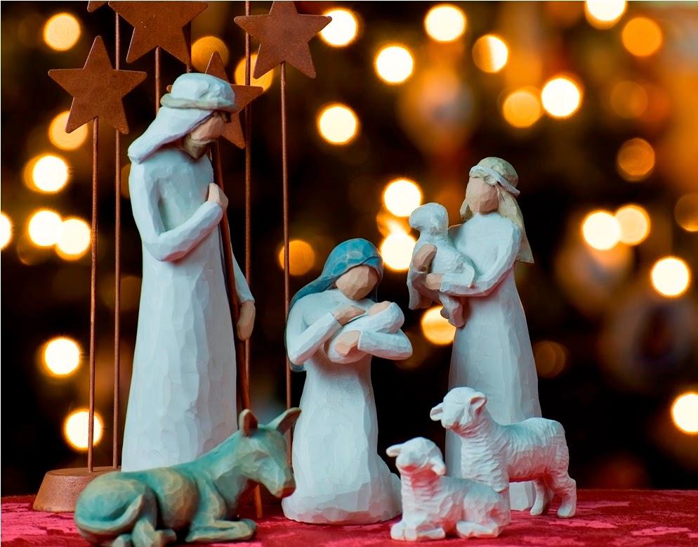 A depiction of the Nativity with a Christmas tree backdrop