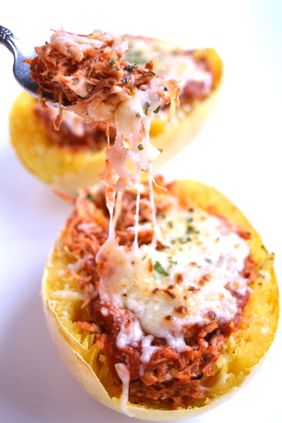 This chicken parmesan stuffed spaghetti squash is a much healthier but still delicious version of your favorite chicken parm. The chicken is cooked in the slow cooker to make it easy! www.nutritionistreviews.com