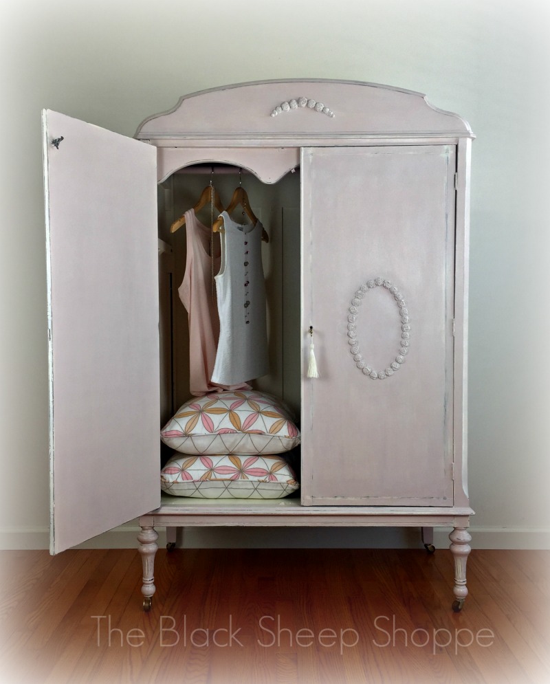 The interior of the armoire was painted in Old White. The interior of the armoire was painted in Old White.