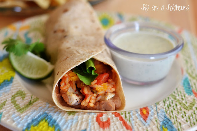These burritos are whole wheat tortillas filled with flavorful grilled chicken, Mexican rice, refried beans and chopped lettuce and tomato. Life-in-the-Lofthouse.com