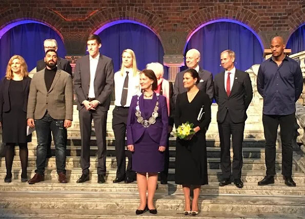 Crown Princess Victoria at 2017 Stockholm Peace Talks. Crown Princess Victoria wore Dagmar Classic Ruffle V-Neck Black Dress