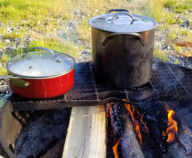 Pots over camp fire