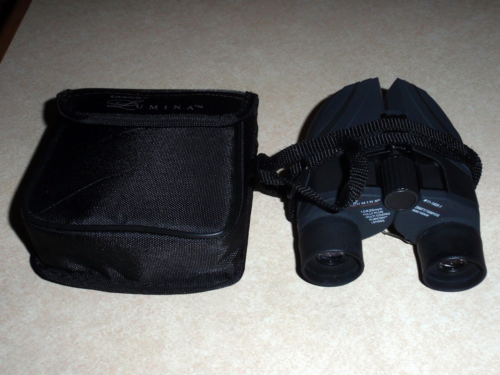 Superstores 10x25mm Binoculars By Tasco Lumina W/ Red Lenses