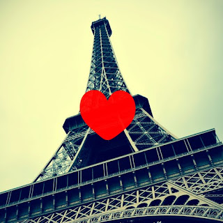 Eiffel Tower, shot from the bottom, with a heart in front of it - Bataclan Concert Hall