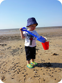 toddler on the beach, building sandcastles, debenhams kidswear