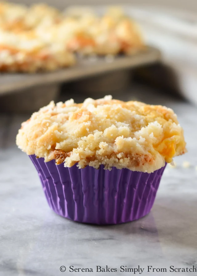 Peach Crumb Muffins are a cake like peach muffin with coffee cake style crumb from Serena Bakes Simply From Scratch.
