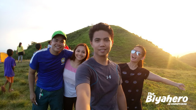The Biyahero with friends with the sunset on background