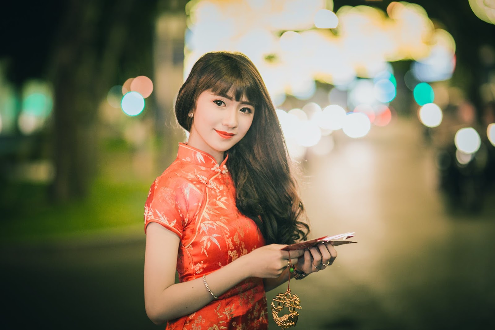 Woman Wearing Red and Brown Chinese Dress
