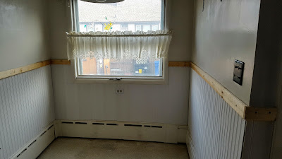 old kitchen with unfinished beadboard and chair rail