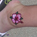 White hibiscus flower tattoo on ankle