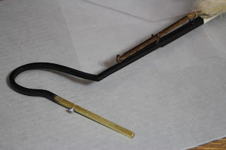 Close-up photo of display mount for plume custom mount designs, Brigid Mountmaking, conservation of military memorabilia, artifacts, antiques at Spicer Art Conservation