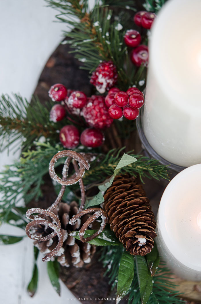 Create a beautiful Christmas vignette in less than 5 minutes with a charger plate, candles, and garland.  |  www.andersonandgrant.com