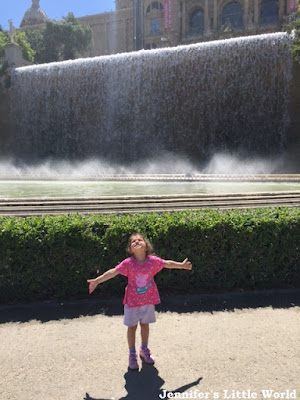 Child in front of fountain in Barcelona