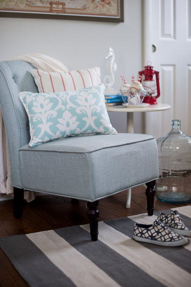 This comfy blue chair pairs well with the patterned accent pillows. 