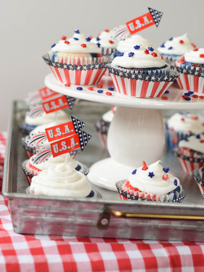 Patriotic cupcakes for your next party! These homemade red, white, and blue cupcakes are the perfect treat for any summer celebration! Celebrate 4th of July with these amazing cupcakes.