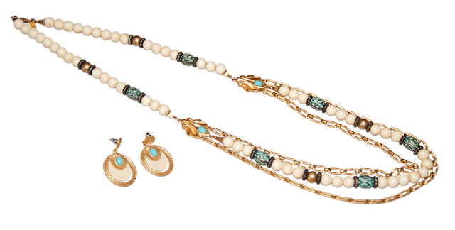 Bead and Chain Necklace A modern necklace of white and gold beads, with long turquoise beads and gold chains. Includes a pair of matching earings.