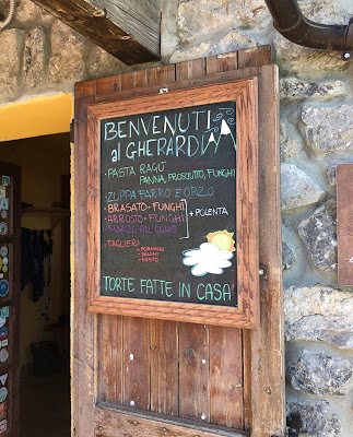 The menu at Rifugio Gherardi including, on this day, pasta, brasato, arrosto and zuppa farro e orzo. The menu at Rifugio Gherardi including, on this day, pasta, brasato, arrosto and zuppa farro e orzo.