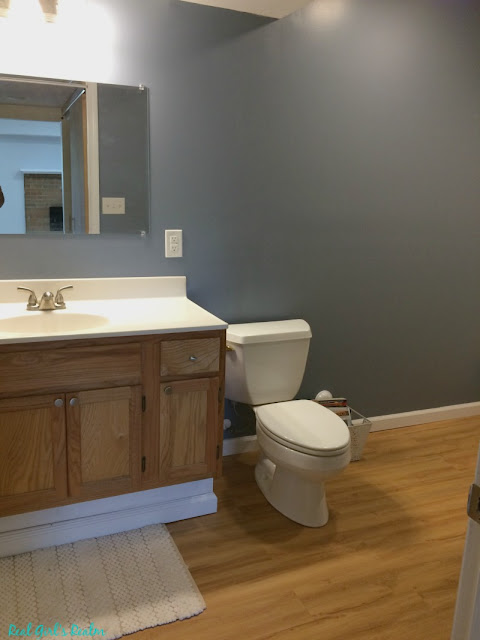 I am finally revealing our basement guest bathroom and how I decorated it on a shoestring budget!