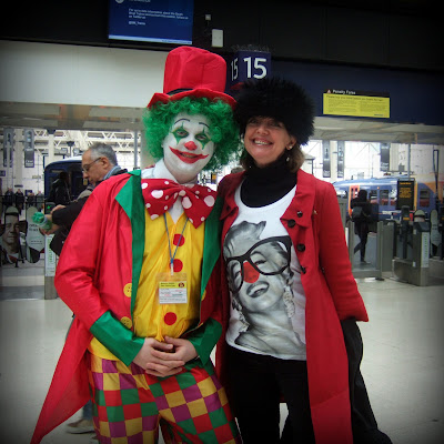 Sophie Neville at Waterloo Station making a donation to Comic Relief on Red Nose Day
