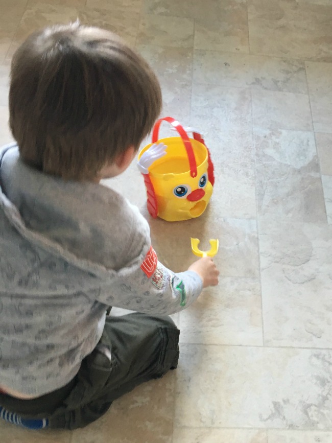 boy-sitting-on-floor-with-r-bucket-game