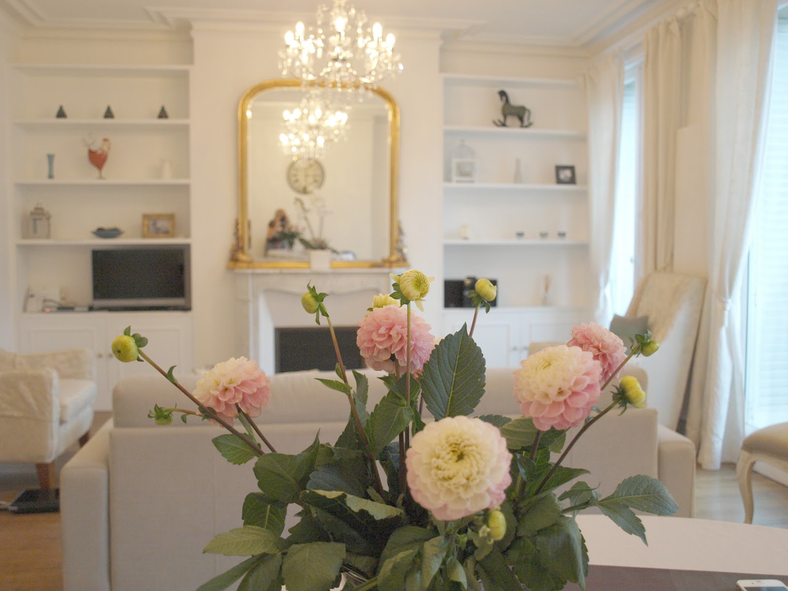 Open shelving in a serene white #livingroom in #Parisapartment by Hello Lovely Studio