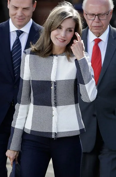 Queen Letizia wore Hugo Boss Karolie Blazer and Carolina Herrera trousers, carried Hugo Boss clutch bag