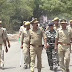 सीआरपीएफ व पुलिस के जवानों ने पनकी में किया फ्लैग मार्च