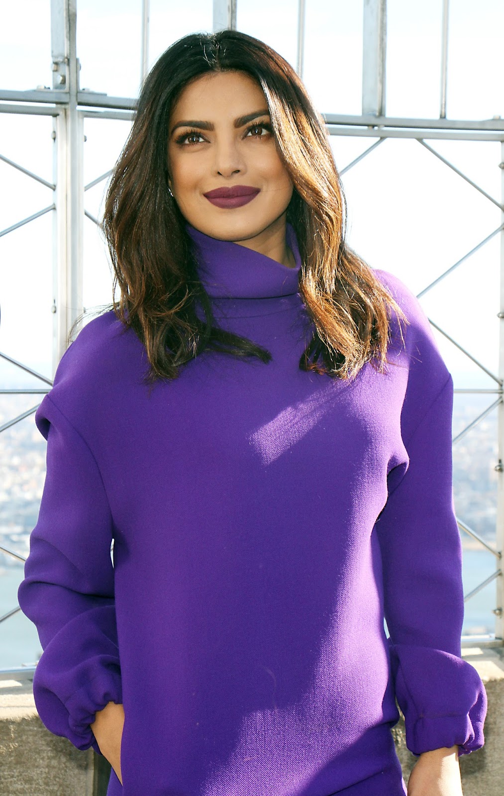 Priyanka Chopra Looks Sexy In a Purple Short Dress and Black Thigh High Boots During â€œQuanticoâ€ Promotion at The Empire State Building in New York City