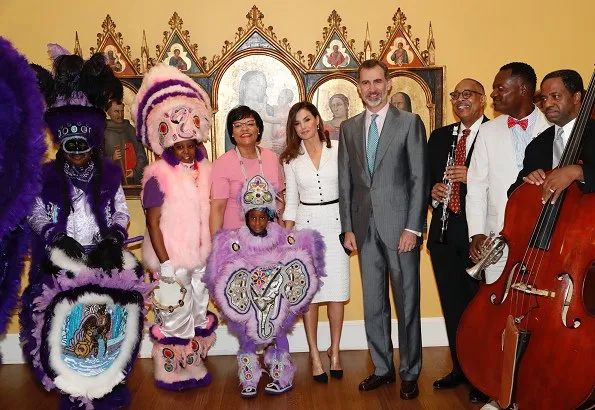 Queen Letizia wore Felipe Varela white dress and Magrit pumps at the Mardi Gras Indians show at New Orleans Museum of Art in City Park