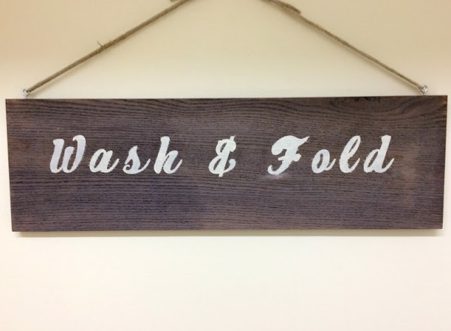 Use Wood Accelerator to age a plain board and make a stenciled farmhouse laundry sign!